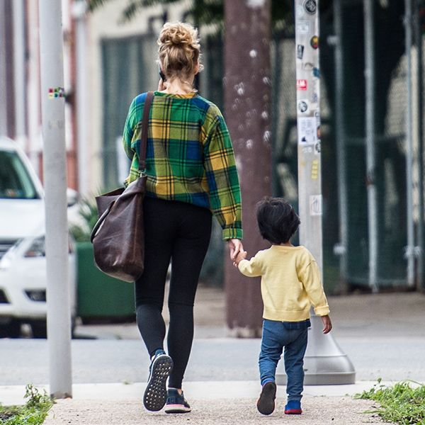 Mother and child walking down the street